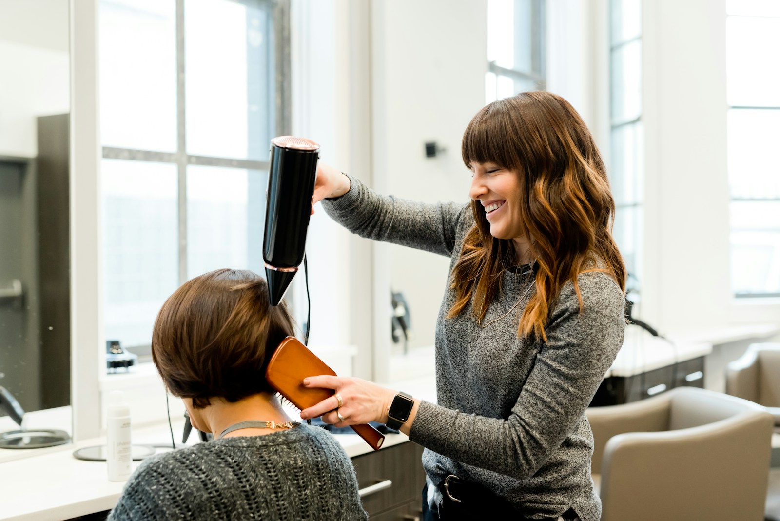 Hair being shaped by a stylist